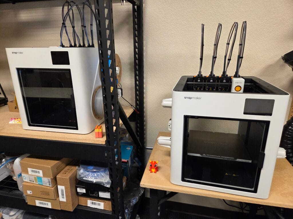 Two Snapmaker U1 3D printers at Monumental Impact
